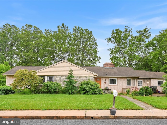 24 Keeler Ave, Stevens, PA 17578 - single story home featuring a front yard, a chimney, and stone siding