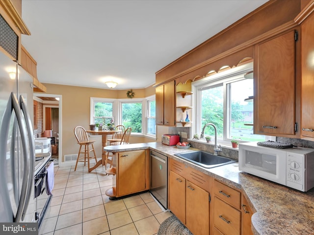 24 Keeler Ave, Stevens, PA 17578 - kitchen featuring stainless steel appliances, light tile patterned flooring, light countertops, a peninsula, and open shelves