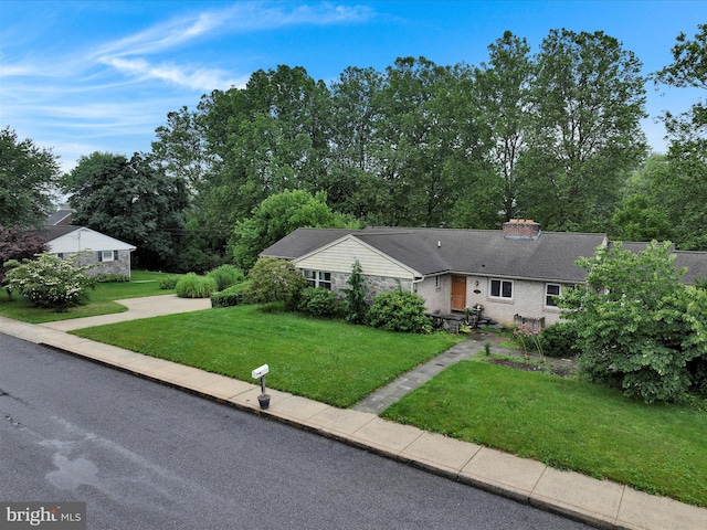 24 Keeler Ave, Stevens, PA 17578 - ranch-style home featuring a front lawn and view of wooded area