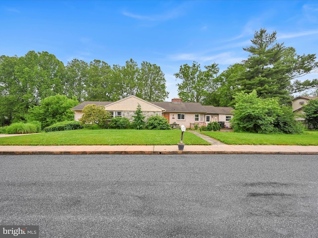 24 Keeler Ave, Stevens, PA 17578 - ranch-style house featuring stone siding, a chimney, and a front yard