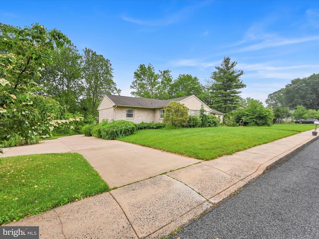 24 Keeler Ave, Stevens, PA 17578 - view of side of home featuring a lawn and brick siding