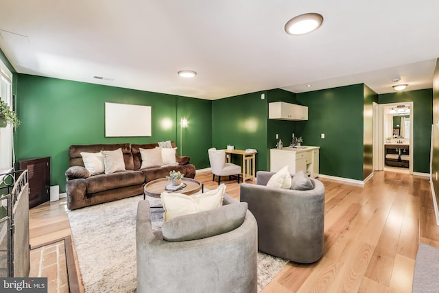 11378 Cromwell Ct, Woodbridge, VA 22192 - living area with visible vents, baseboards, and light wood-type flooring
