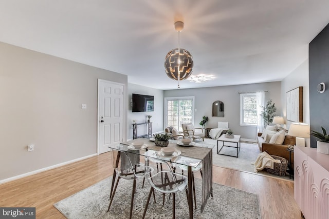 11378 Cromwell Ct, Woodbridge, VA 22192 - dining room featuring light wood-type flooring, baseboards, and plenty of natural light
