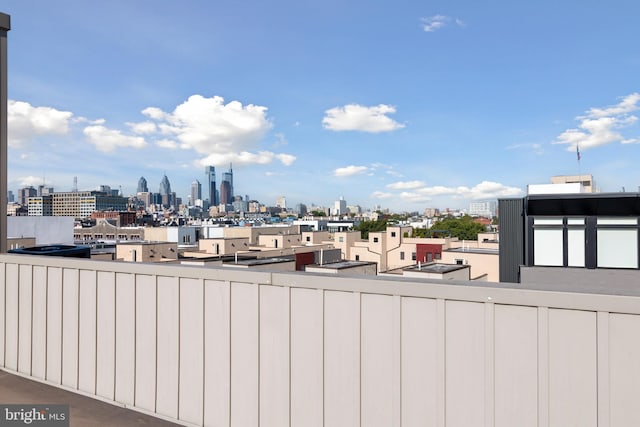 balcony featuring a skyline view