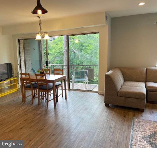 dining area with recessed lighting and wood finished floors