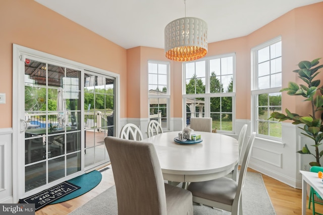 812 Lincoln Rd, Mullica Hill, NJ 08062 - dining room featuring wainscoting, wood finished floors, a chandelier, and a decorative wall