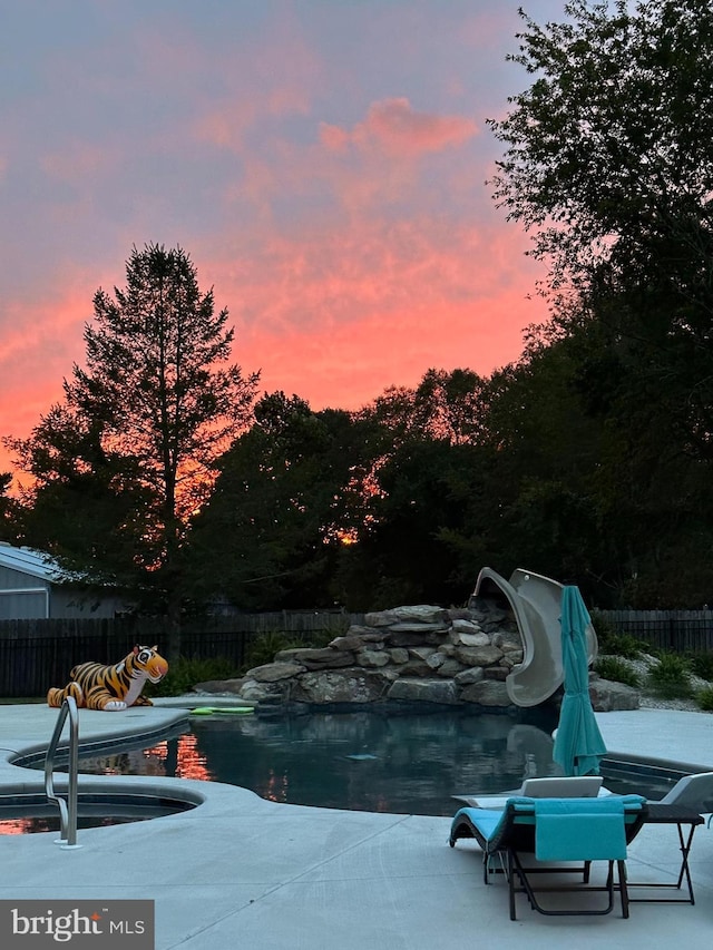 812 Lincoln Rd, Mullica Hill, NJ 08062 - pool at dusk with a patio area