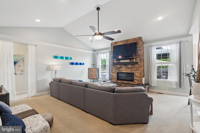 812 Lincoln Rd, Mullica Hill, NJ 08062 - living area with carpet flooring, a stone fireplace, vaulted ceiling, baseboards, and ceiling fan