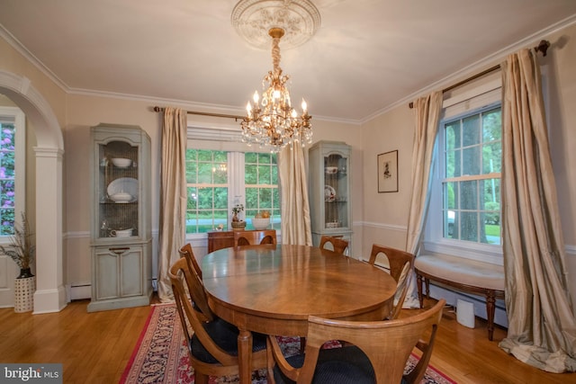 1511 Camden Ave, Salisbury, MD 21801 - dining area with plenty of natural light, light wood-type flooring, a chandelier, and crown molding