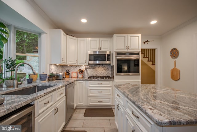 1511 Camden Ave, Salisbury, MD 21801 - kitchen with stainless steel appliances, beverage cooler, a sink, light tile patterned flooring, and backsplash