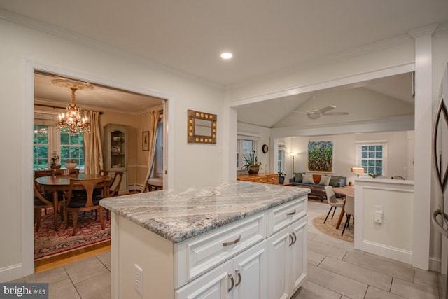 1511 Camden Ave, Salisbury, MD 21801 - kitchen with light tile patterned flooring, open floor plan, white cabinetry, lofted ceiling, and a chandelier