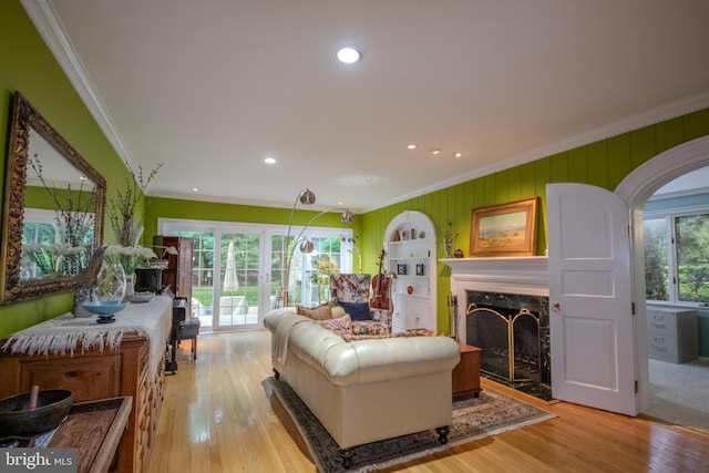 1511 Camden Ave, Salisbury, MD 21801 - living room with crown molding, a high end fireplace, wood finished floors, recessed lighting, and arched walkways