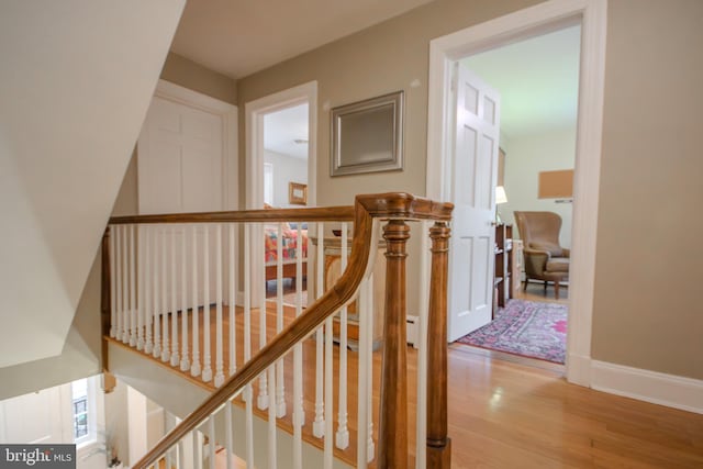1511 Camden Ave, Salisbury, MD 21801 - corridor featuring an upstairs landing, wood finished floors, and baseboards