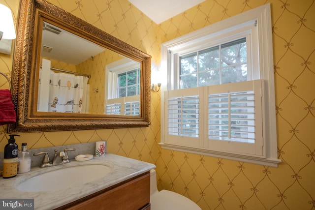 1511 Camden Ave, Salisbury, MD 21801 - bathroom featuring wallpapered walls, vanity, and toilet