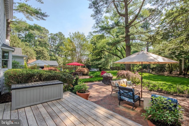 1511 Camden Ave, Salisbury, MD 21801 - deck with outdoor lounge area, a patio area, a grill, and view of wooded area