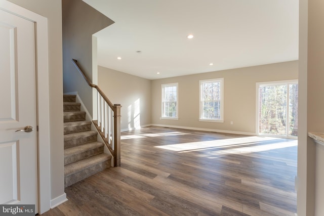 entryway featuring stairs, recessed lighting, baseboards, and wood finished floors