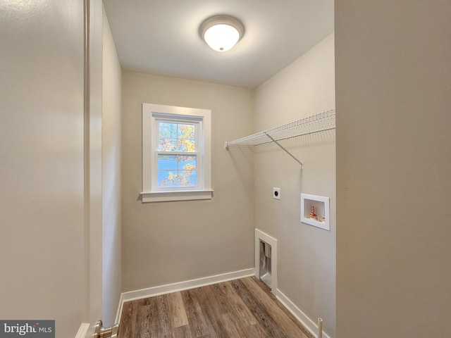 washroom with laundry area, wood finished floors, baseboards, hookup for a washing machine, and hookup for an electric dryer