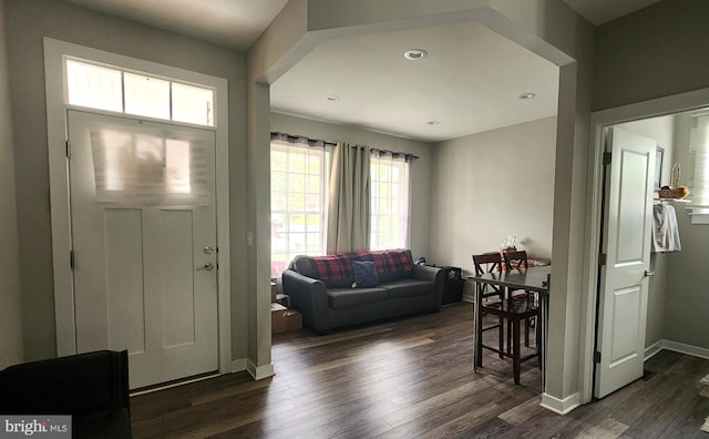 foyer entrance with recessed lighting, baseboards, and dark wood finished floors
