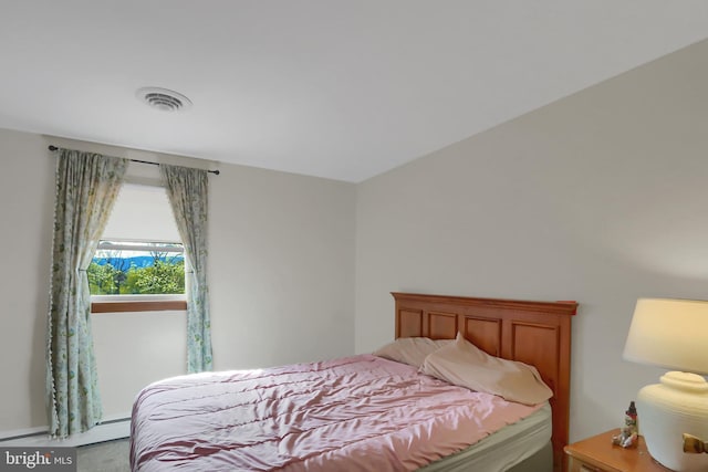 bedroom featuring visible vents and baseboard heating