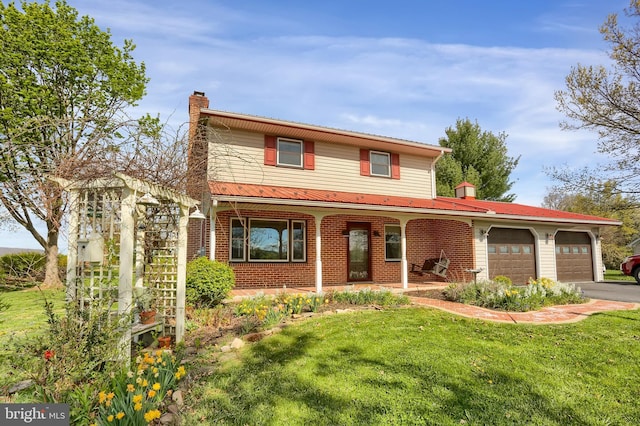 traditional-style house featuring a chimney, an attached garage, a porch, and a front lawn