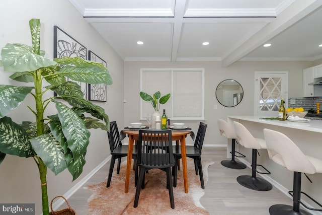 dining space featuring coffered ceiling, beamed ceiling, light wood-type flooring, and recessed lighting