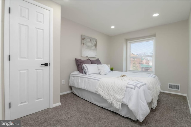 carpeted bedroom with recessed lighting, visible vents, and baseboards
