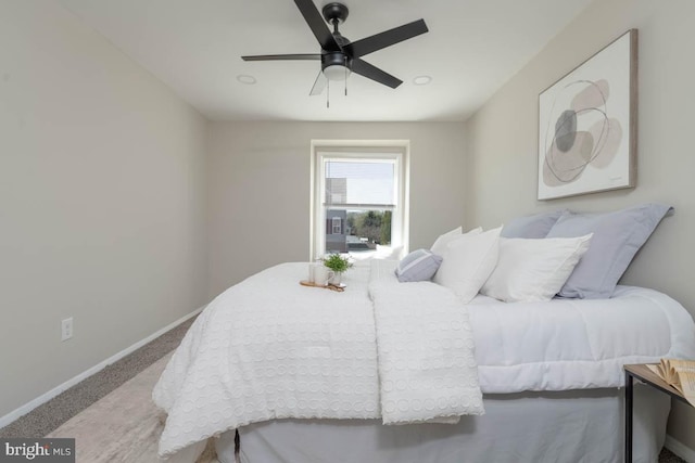 bedroom with baseboards, carpet floors, and ceiling fan