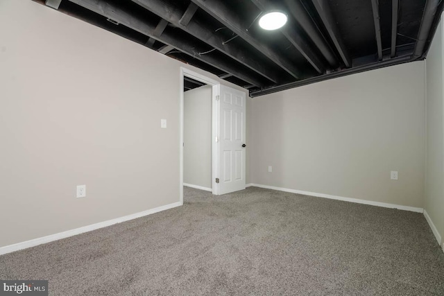 finished below grade area with baseboards and carpet