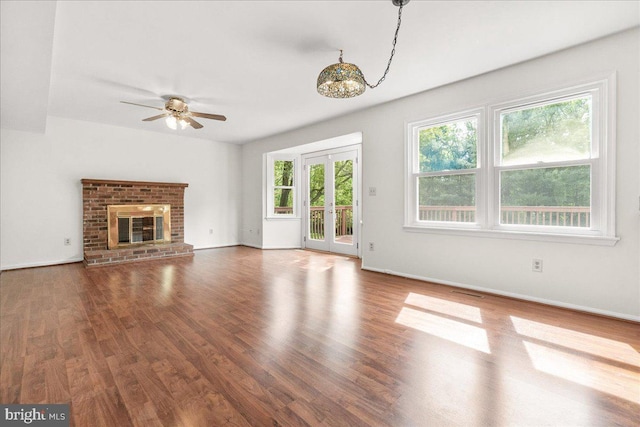 3903 Thrasher Ct, Monrovia, MD 21770 - unfurnished living room with ceiling fan, wood finished floors, baseboards, and a brick fireplace