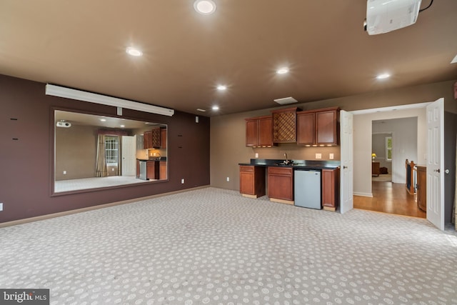 129 Kirwans Landing Ln, Chester, MD 21619 - kitchen with light colored carpet, recessed lighting, open floor plan, baseboards, and dark countertops