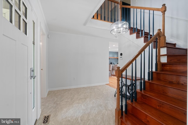 129 Kirwans Landing Ln, Chester, MD 21619 - stairs featuring baseboards and crown molding