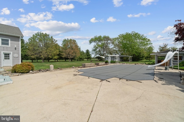 129 Kirwans Landing Ln, Chester, MD 21619 - view of pool with a water slide, a covered pool, a patio, a yard, and a pergola