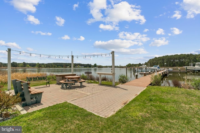 129 Kirwans Landing Ln, Chester, MD 21619 - view of home's community with a boat dock, a water view, a lawn, and a patio