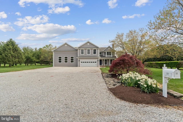 129 Kirwans Landing Ln, Chester, MD 21619 - view of front of house featuring gravel driveway, a garage, and a front yard
