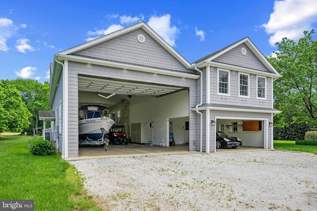 129 Kirwans Landing Ln, Chester, MD 21619 - victorian house featuring a garage and gravel driveway