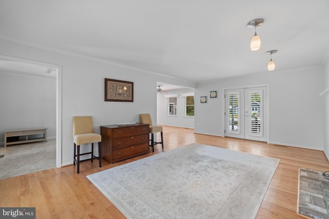 129 Kirwans Landing Ln, Chester, MD 21619 - living room featuring crown molding, light wood-style flooring, a ceiling fan, and baseboards
