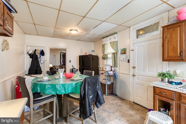 804 W King St, York, PA 17403 - dining room with light floors, wainscoting, and a paneled ceiling