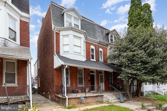 804 W King St, York, PA 17403 - second empire-style home with covered porch, brick siding, and a shingled roof