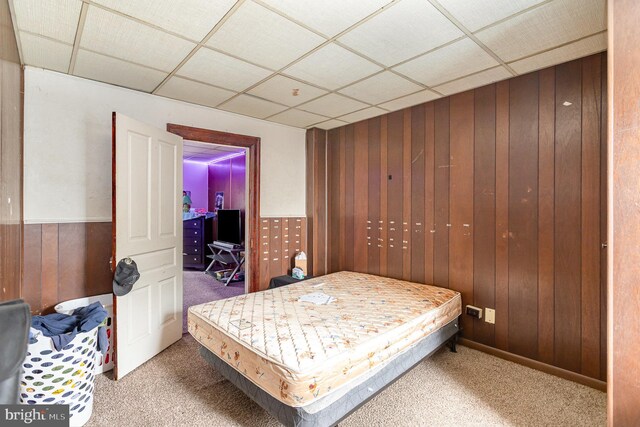 804 W King St, York, PA 17403 - carpeted bedroom featuring wood walls, wainscoting, and a paneled ceiling