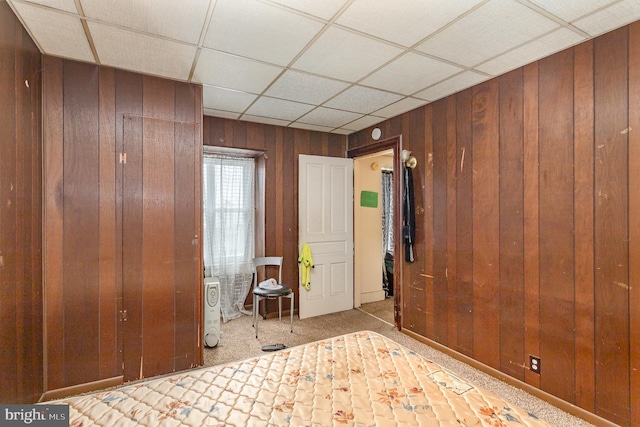 804 W King St, York, PA 17403 - carpeted bedroom featuring wood walls and a paneled ceiling
