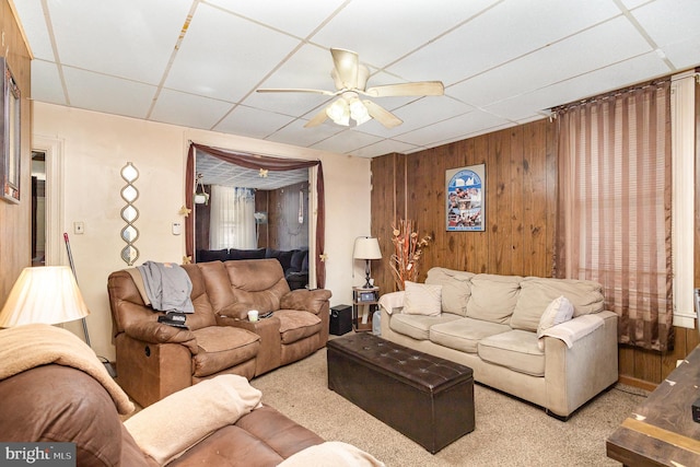 804 W King St, York, PA 17403 - carpeted living area with a ceiling fan, a paneled ceiling, and wooden walls