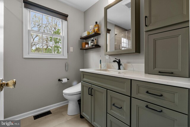 full bath featuring baseboards, toilet, visible vents, tile patterned flooring, and vanity