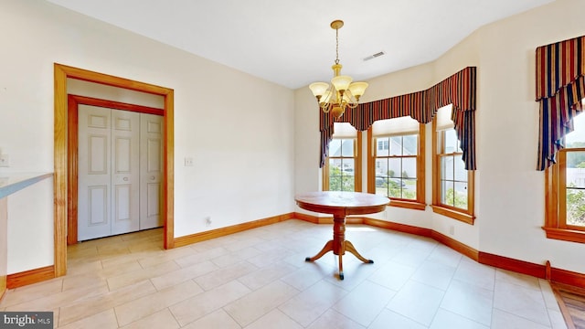 28342 Discount Land Rd, Laurel, DE 19956 - unfurnished dining area with visible vents, a notable chandelier, and baseboards
