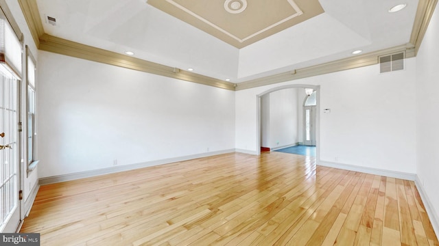28342 Discount Land Rd, Laurel, DE 19956 - unfurnished room featuring a raised ceiling, visible vents, wood-type flooring, arched walkways, and recessed lighting