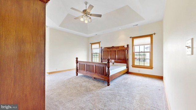 28342 Discount Land Rd, Laurel, DE 19956 - bedroom with ceiling fan, carpet flooring, baseboards, visible vents, and a raised ceiling