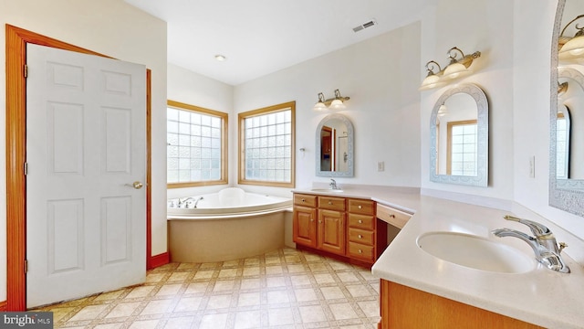 28342 Discount Land Rd, Laurel, DE 19956 - full bath featuring tile patterned floors, two vanities, a bath, and a sink