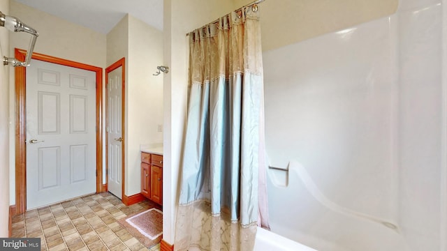 28342 Discount Land Rd, Laurel, DE 19956 - full bathroom with curtained shower, vanity, and stone finish flooring