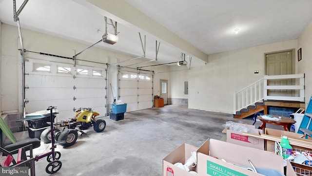 28342 Discount Land Rd, Laurel, DE 19956 - garage featuring a garage door opener and electric panel