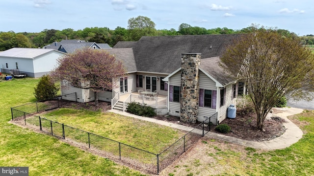 28342 Discount Land Rd, Laurel, DE 19956 - view of front of property with a chimney, a deck, a fenced backyard, crawl space, and a front yard