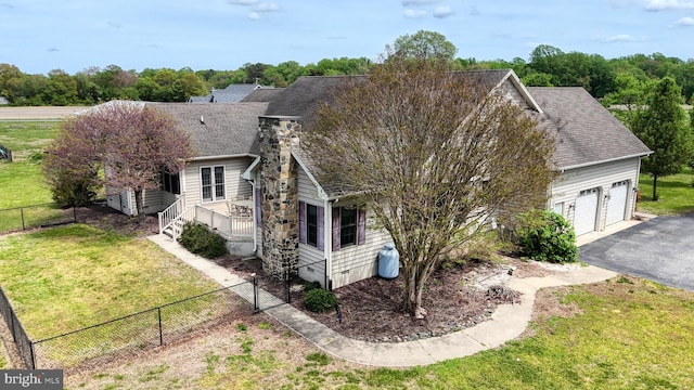 28342 Discount Land Rd, Laurel, DE 19956 - view of property exterior with a yard, aphalt driveway, and a fenced backyard